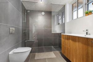 a bathroom with a shower and a toilet and a sink at 8569-Grenaa-Kystvej-3-b in Grenå Strand +19 photos