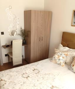 a bedroom with a bed and a desk and a cabinet at Royal Welcome Casanearshore B&B in Casablanca
