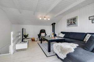 a living room with a couch and a table at C11596-Hemmet-Vester-Faelled-51 in Hemmet
