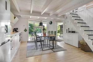 a kitchen and dining room with a table and a staircase at C11596-Hemmet-Vester-Faelled-51 in Hemmet +30 photos