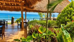 a restaurant with a view of the ocean at Laola Surf Residence in El Sunzal