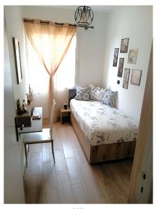 a bedroom with a bed and a desk and a window at Royal Welcome Casanearshore B&B in Casablanca
