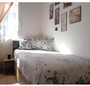 a bedroom with a bed with pillows on it at Royal Welcome Casanearshore B&B in Casablanca