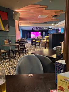 a dining room with tables and chairs and a restaurant at Luxury 2 Bed Caravan With Decking - Sleeps 4 - at Broadland Sands Park in Lowestoft