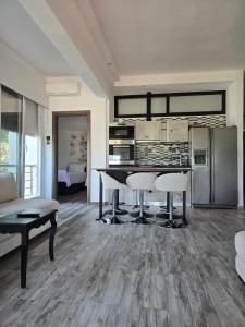 a kitchen with a table and chairs in a room at Villa Mare Lux in Nea Fokea +15 photos