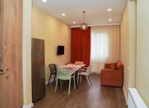 a kitchen and dining room with a table and chairs at "Mtis broli 77"-Mzetamze-Borjomi in Mzet'amze +23 photos