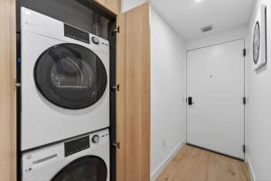 a laundry room with two washer and dryer at Downtown Miami Luxe 1BR! in Miami +11 photos
