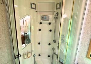 a bathroom with a shower and a toilet at Casa Silvestre in Melides