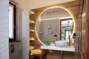 a bathroom with a sink and a mirror at Albergo Ristorante Conca Azzurra in Colico +106 photos