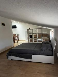 a bedroom with a large bed in a room at Cuore Selargius in Selargius