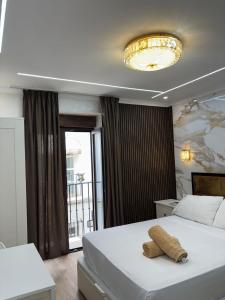 a bedroom with a bed with a towel on it at Boutique Princesa in Marbella