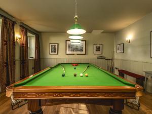 a pool table with balls on it in a room at Villa Abbotsford by Interhome in Darnick