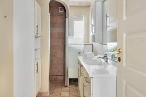 a white bathroom with a sink and a shower at 1670-Melby-Kragesvej-36 in Melby +20 photos