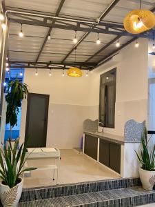 a lobby with a reception desk and potted plants at CoCo SEA in Mui Ne