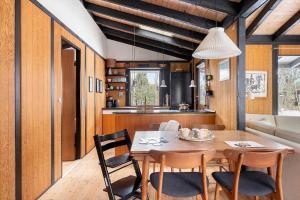 a kitchen and dining room with a table and chairs at 1673-Hundested-Moller-Ager-7 in Hundested +21 photos