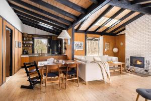 a living room with a white couch and a table at 1673-Hundested-Moller-Ager-7 in Hundested