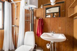 a bathroom with a toilet and a sink at 1673-Hundested-Moller-Ager-7 in Hundested