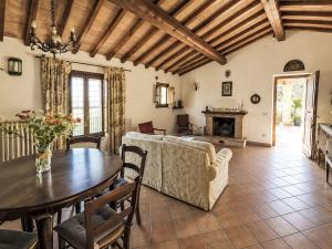 a living room with a couch and a table at Villa Le More by Interhome in Penna in Teverina