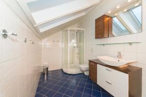 a bathroom with a sink and a toilet at Rorbuene Svolvær Havn in Svolvær +83 photos