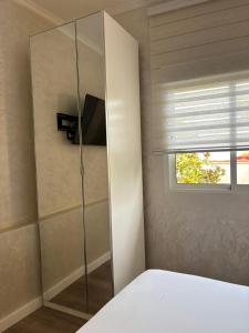 a bedroom with a glass shower stall with a window at Boutique Princesa in Marbella +52 photos