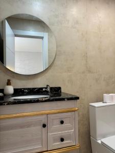 a bathroom with a mirror and a sink at Boutique Princesa in Marbella