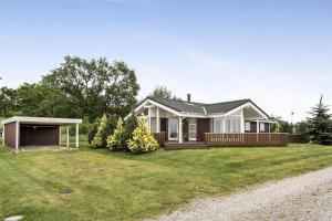 a house with a large yard at 30729-Odder-Alrovej-203-C in Odder