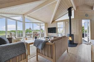a living room with a couch and a fireplace at 30729-Odder-Alrovej-203-C in Odder