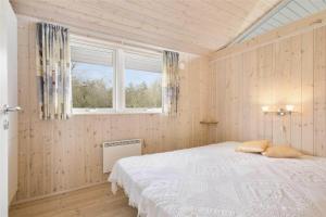 a bedroom with a bed and a window at 30729-Odder-Alrovej-203-C in Odder