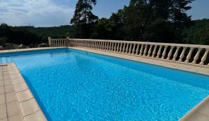 a large blue swimming pool next to a fence at Chateau De La Ricardie, Gite La Ricardie, Beautiful Rural Property Gite Villa in Liorac +36 photos