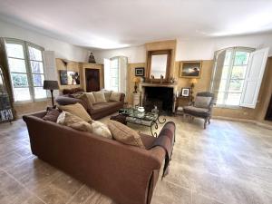a living room with two couches and a fireplace at LS7-468 - Eicela in Saint-Antonin-sur-Bayons