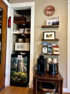 a room with a table and a clock on a wall at Maple Woods B&B in Honeymoon Bay +30 photos