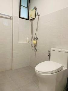 a bathroom with a toilet and a shower at Palmhouse studio room in Bang Khen +29 photos
