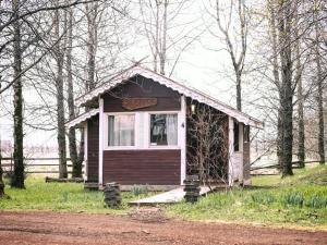 a small house in the middle of a forest at Ásgarður Guesthouse in Hvolsvöllur