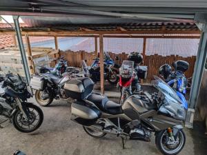 a group of motorcycles parked in a garage at Hôtel/Restaurant C'Vall in Urepel