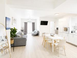 a living room with a couch and a table at Aroma D Valencia Luxury and Designer Apartment in Valencia