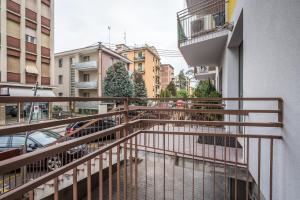 an apartment balcony with a view of a street at Casa Amelia - Elegant Suite [parcheggio gratuito] in Parma