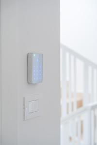 an ipod plugged into a light switch on a wall at Palazzo Ambra in Soverato Marina +36 photos