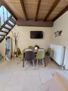 a dining room with a table and chairs at The Mastiha Spot 8 in Chios