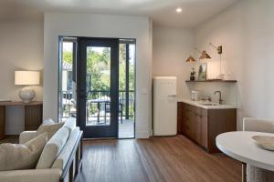 a kitchen and living room with a couch and a table at Duchamp Healdsburg in Healdsburg
