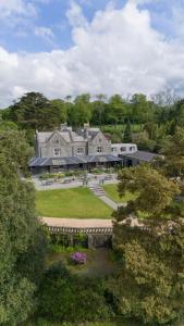 an aerial view of a large house with a yard at Bron Eifion Hotel in Criccieth