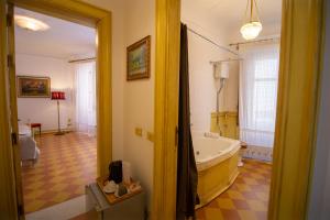 a bathroom with a bath tub in a room at Atenea Luxury Suites - Atenea Collection in Agrigento +73 photos