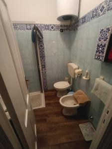 a bathroom with a toilet and a shower at Casa Alby in Nulvi