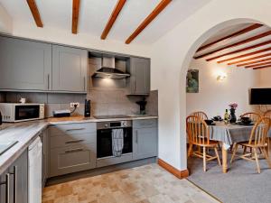 a kitchen with a table and a dining room at 2 Bed in Dereham oc-92392 in Whissonsett