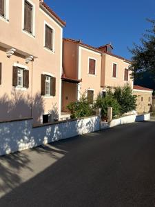 a row of houses on the side of a road at GG Αpartment in Leonidio +5 photos