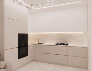 a kitchen with white cabinets and a chandelier at Lutsk Elegance Apartment in Lutsk