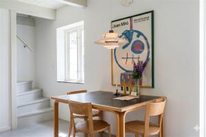 a dining room with a table and chairs at Gladeholm in Kivik