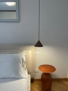 a bedroom with a bed with a table next to it at Modern Apartment Empoli in Empoli