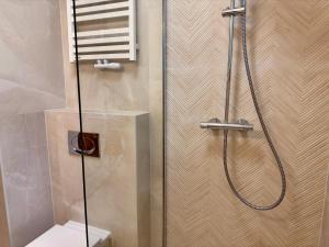 a shower in a bathroom with a toilet and a glass door at Villa Gdynia in Gdynia +42 photos