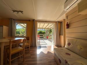 a living room with a table and a dining room at l echo du canigou in Sahorre +111 photos