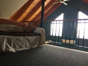 a bedroom with a bed and a ceiling fan at 15 on Blair in Peterborough